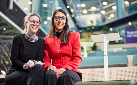 This image shows two NatWest Group female colleagues sat down together.